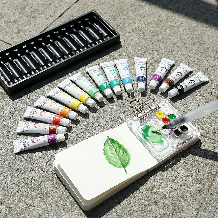 Set Portátil de Acuarelas de Viaje con 12 Colores, Paleta, Pincel y Mini Cuaderno 8 x 8 cm